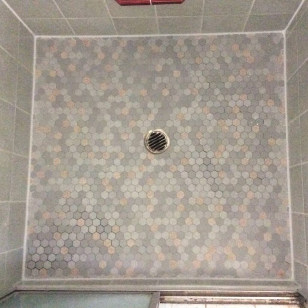 Hexagon mosaic shower floor after regrouting